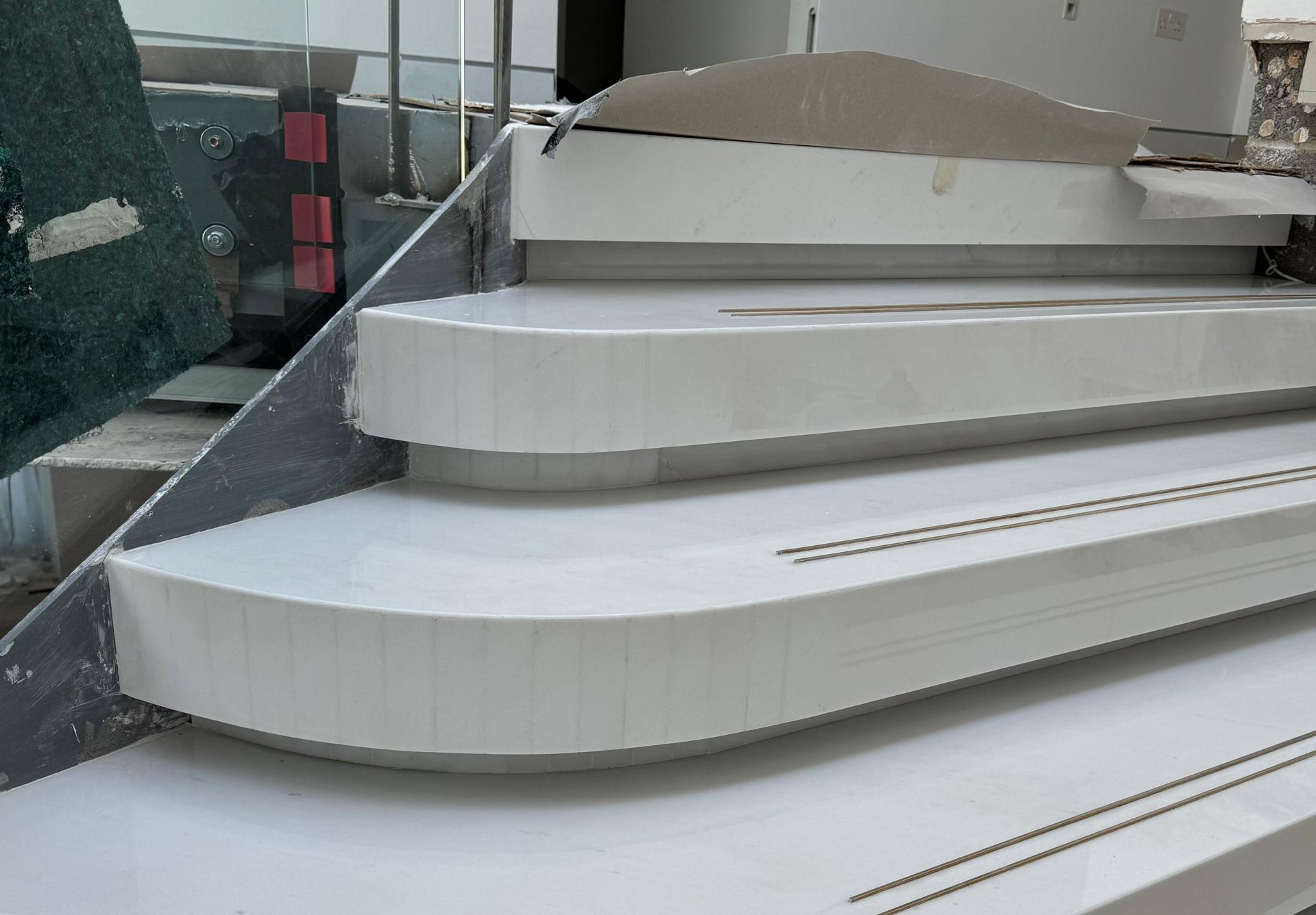Curved white marble staircase