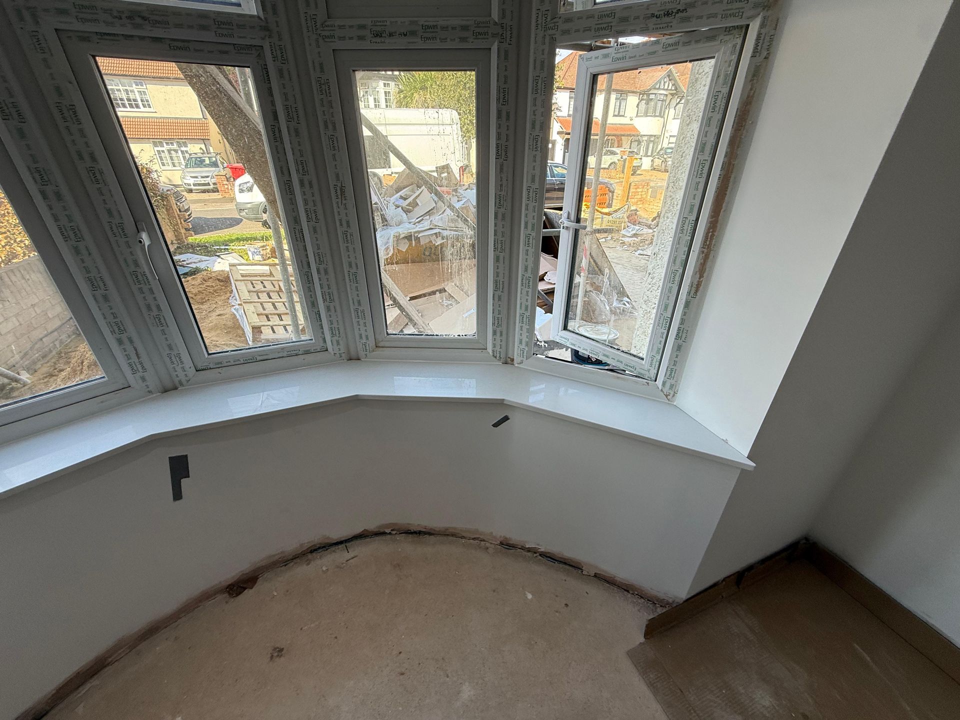 Curved stone window sill in a bay window